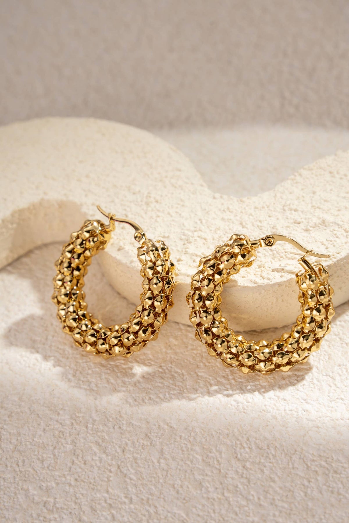 Gold stainless steel woven hoop earrings