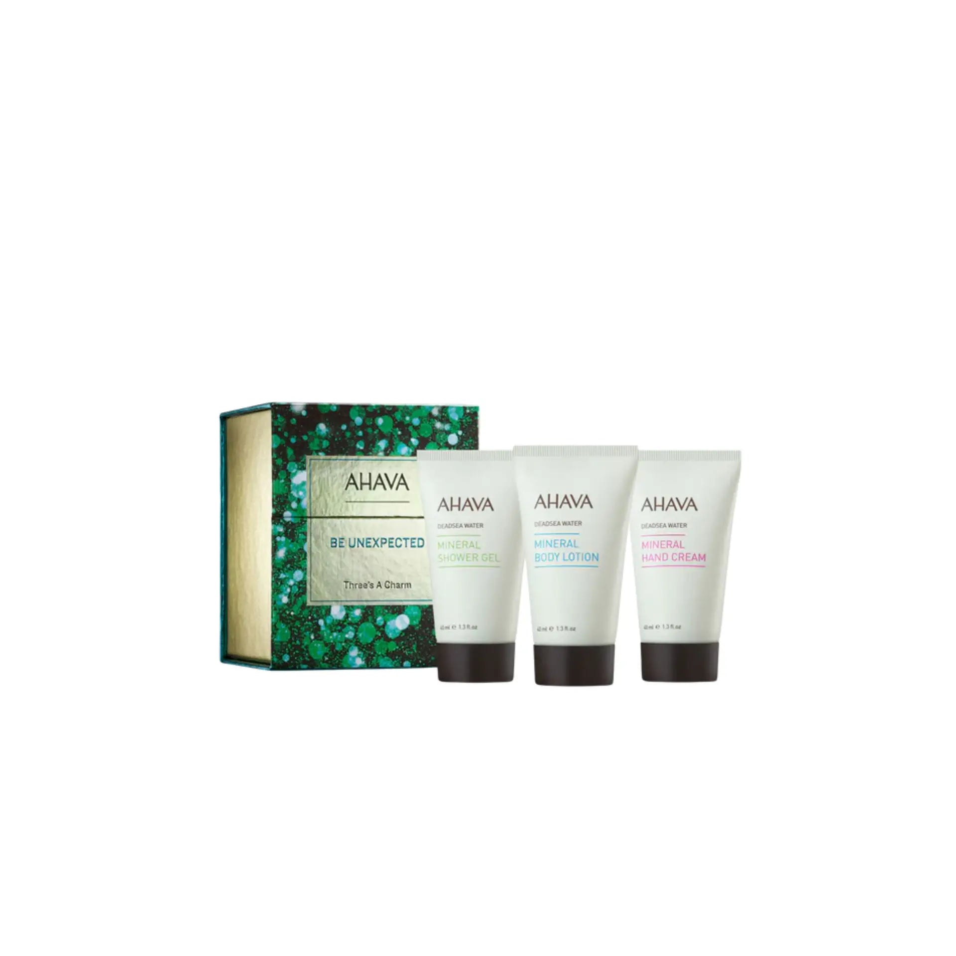 Ahava Three’s A Charm set featuring Mineral Hand Cream, Body Lotion, and Shower Gel in travel sizes.