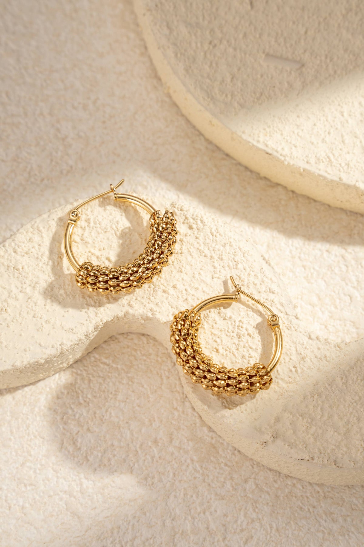 Trendy textured golden stainless steel hoop earrings