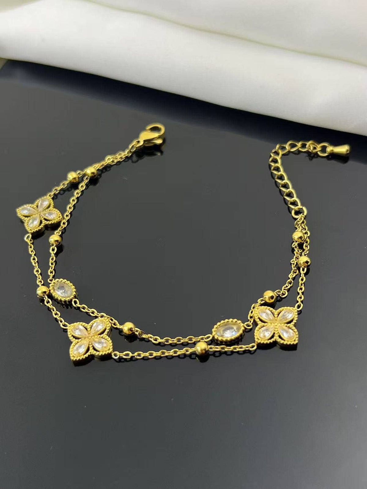 Double wrap flower and crystal bracelet in stainless steel
